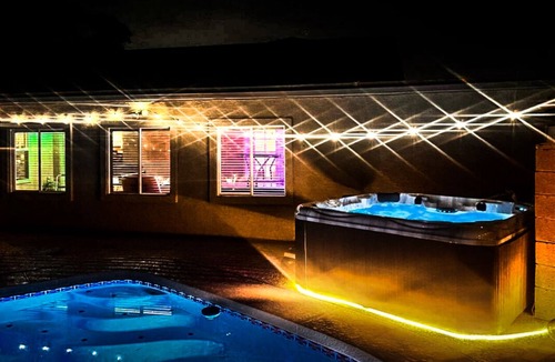 La Buena Vida House | 8 minute walk to State Farm Stadium, 5 rooms 7 bed home with pool/spa/game room