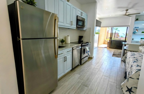 Cabo Bello Condo | Brand New Listing: Elegant Studio Suite with Ocean and Pool View
