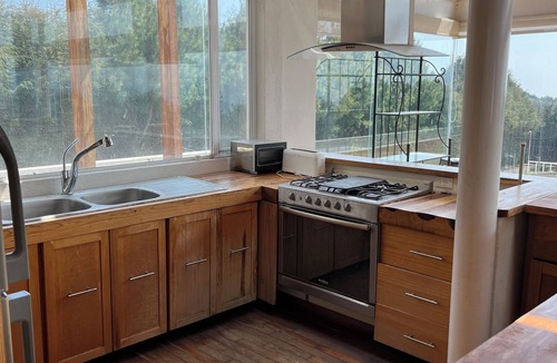 Tlalpan House | Casa de Vidrio: Eco Lux Refuge with Jacuzzi, fireplace and volcano view.