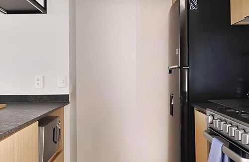 Zona Minerva Apartment | City-view retreat - 2BR & resort access