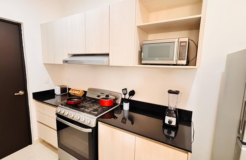 Puerto Juarez Apartment | Modern Apartment with Pool for a Relaxing Stay