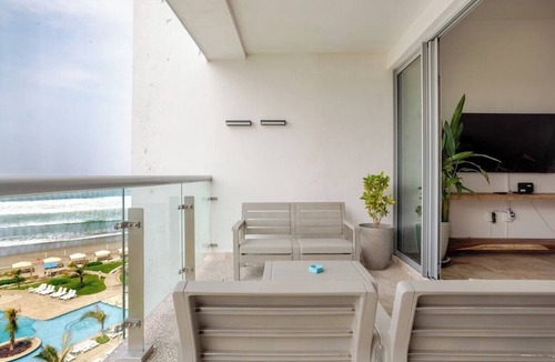 Playa Diamante Apartment | Oceanfront condo with a pool, hot tub, and spectacular view