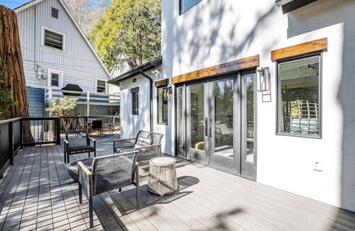 Cedar Glen House | Stunning lakehouse lodge with a deck, fireplace, lush patio & lake access