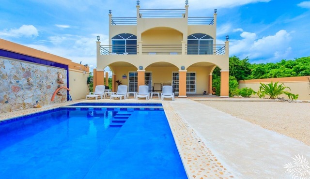 Beautiful private gated 2 bedroom home with pool, terraces and ample parking.