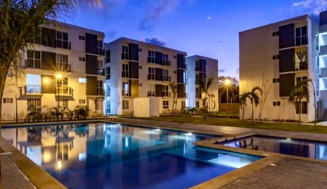 Confort Condo with semi-Olympic pool, Wifi, AC, Grill, Balcony, Garden