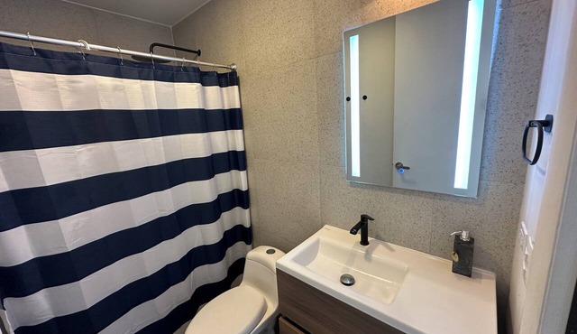 Sleek Modern Condo in Downtown Tijuana - Free Parking, 24/7 Security, and Rooftop