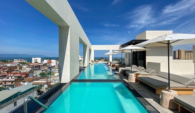 Blissful Ocean-View Penthouse with Rooftop Pool